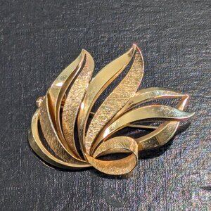 Elegant gold tone brooch, abstract leaf brooch